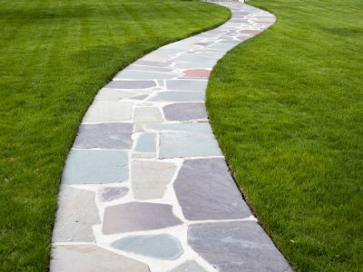 This is an image of a stone walkway with concrete.